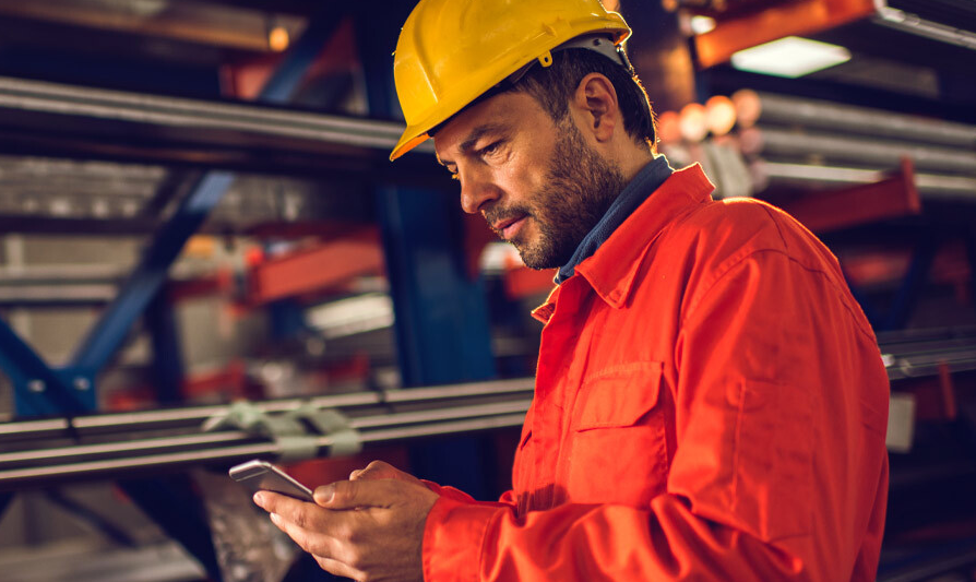 Man on phone near used machine